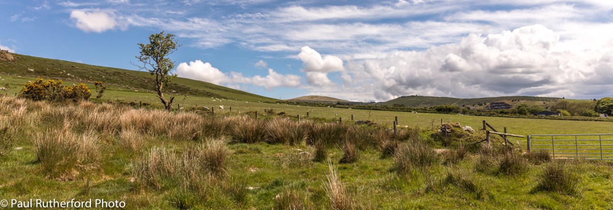 A view across the landscape in the western end of the Preseli Hills in north Pembrokeshire, Wales, with fields and open moorlands.