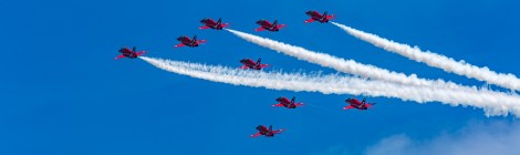 The RAF display team, the Red Arrows performing their thrilling aerobatic display at Swansea seafront on July 2nd, 2017. Here flying in formation, up and away to towards 11 o'clock. Three are trailing white smoke.